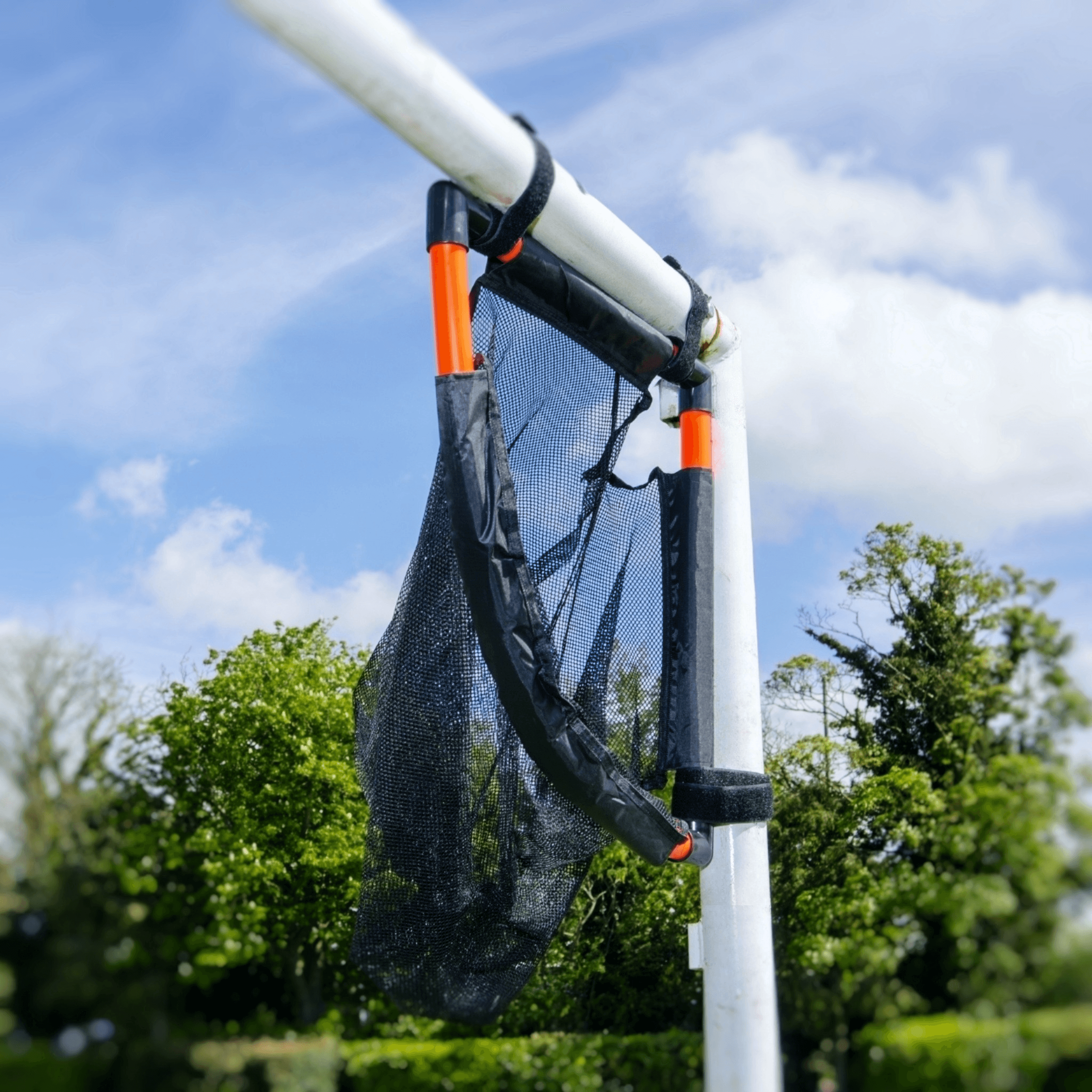 Angled close-up of the TopCorner target attached to a goal post outdoors