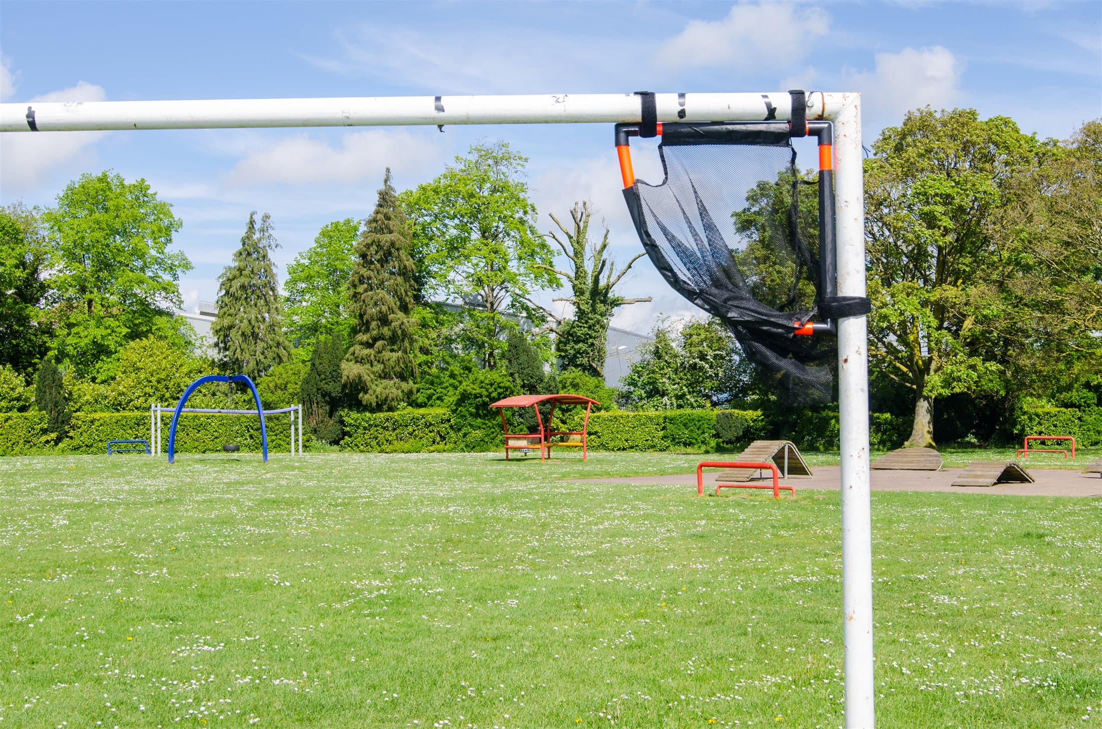 Wide football pitch photo showing the TopCorner training target fixed to the goal
